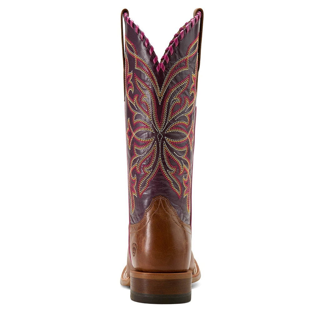 Brown cowboy boot with intricate purple and red embroidery on a white background