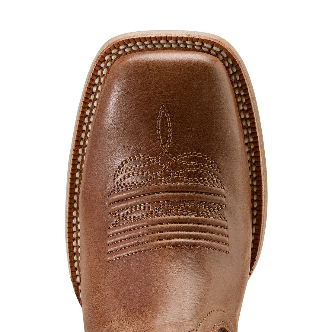 Close-up of a brown leather boot with intricate stitching on a white background