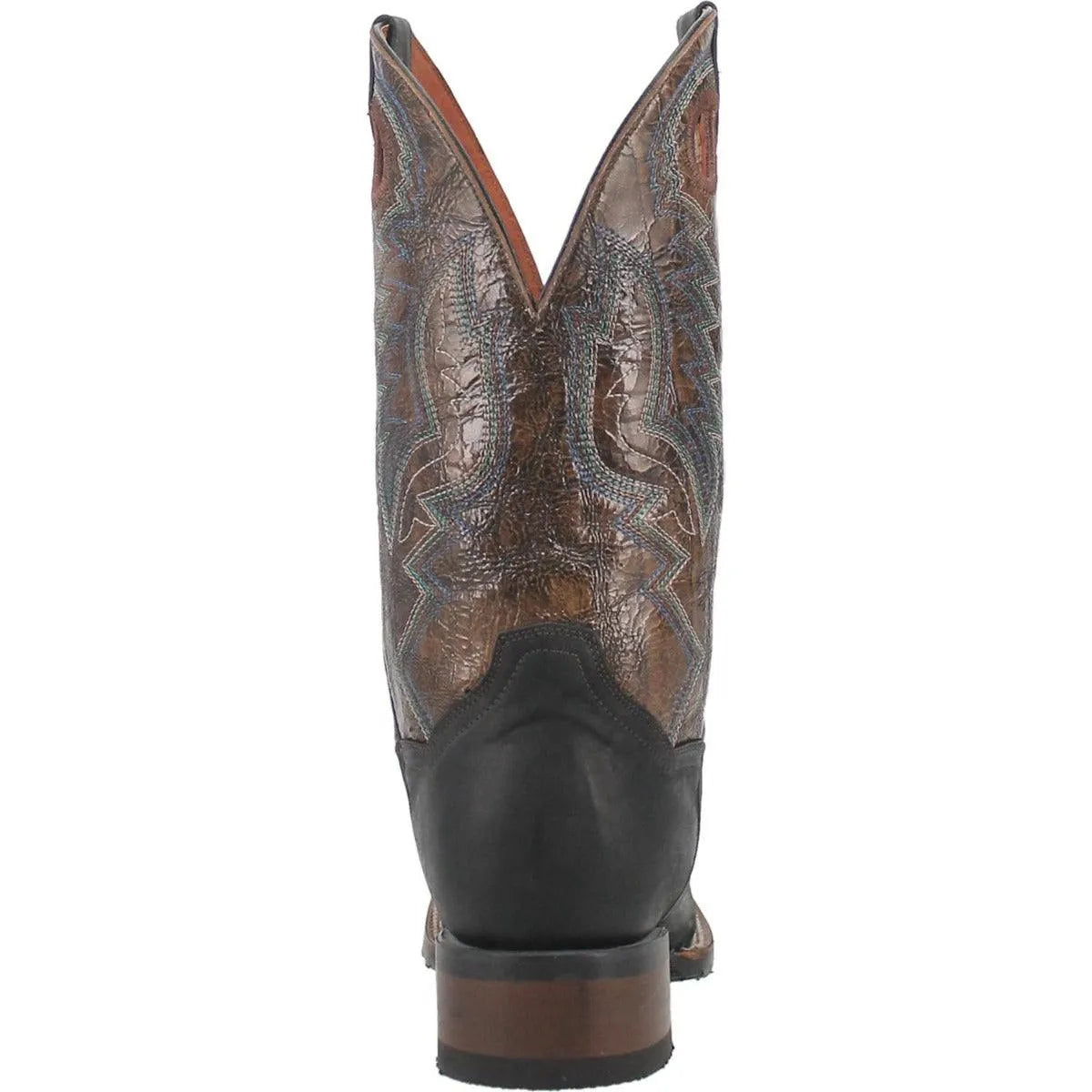Close-up of a brown and black cowboy boot with intricate design on a white background